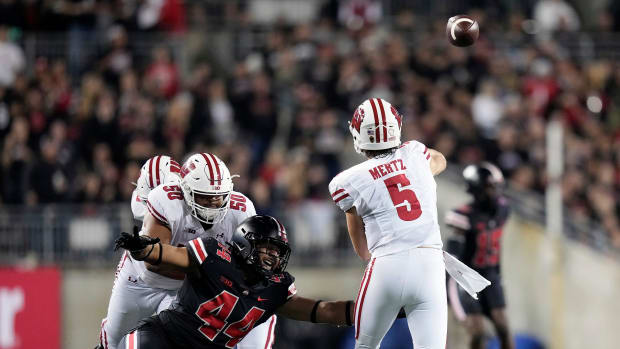 Wisconsin quarterback Graham Mertz throwing the football against Ohio State.